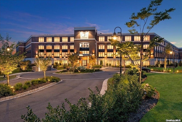 view of outdoor building at dusk