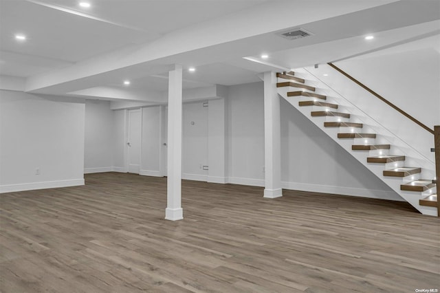 basement with wood-type flooring