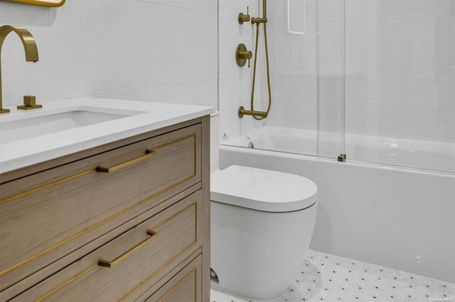 full bathroom featuring bath / shower combo with glass door, toilet, tile walls, and sink