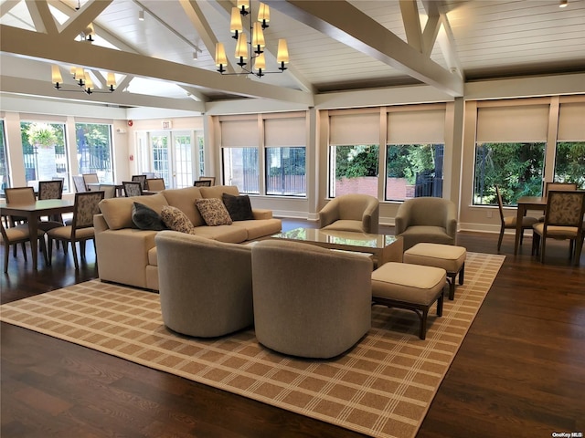 interior space with vaulted ceiling with beams, an inviting chandelier, and wood ceiling