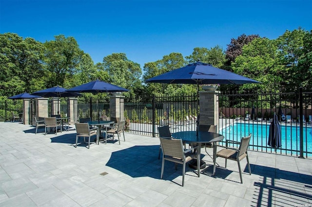 view of patio with a community pool