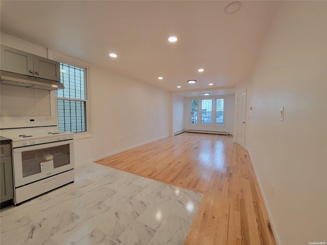 kitchen featuring baseboards, recessed lighting, gray cabinets, under cabinet range hood, and white gas range