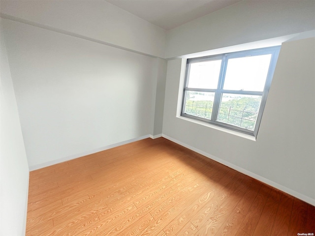 spare room featuring light hardwood / wood-style floors