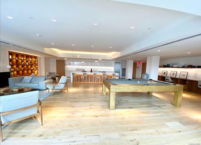 game room with pool table and light hardwood / wood-style flooring