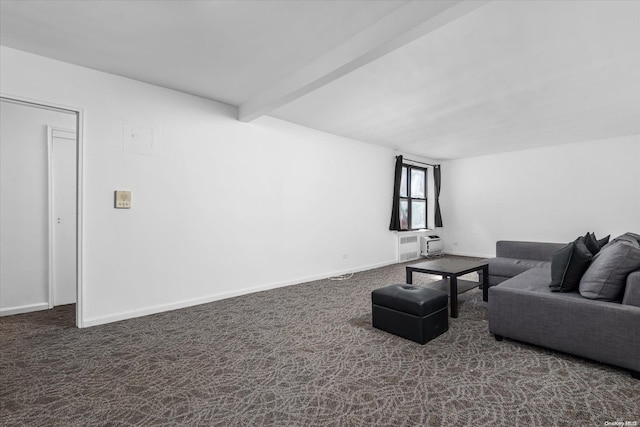 living room featuring dark colored carpet and beam ceiling