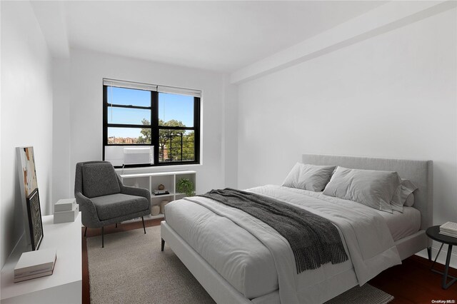 bedroom with carpet and cooling unit