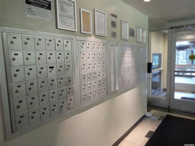 hallway featuring mail boxes