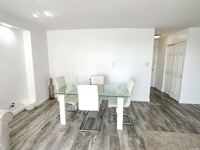 dining room with dark hardwood / wood-style flooring