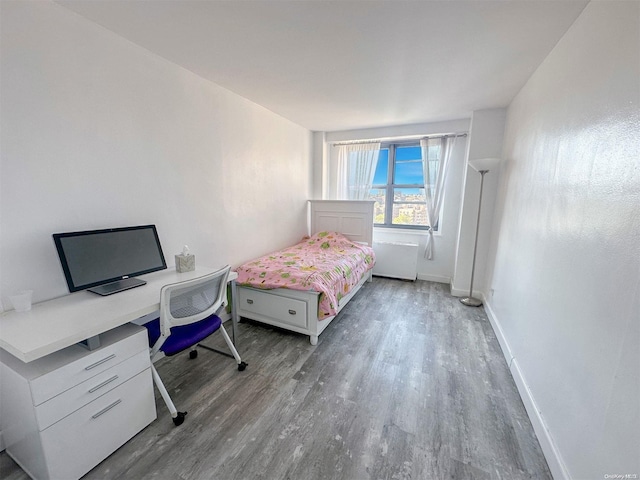 bedroom with wood-type flooring