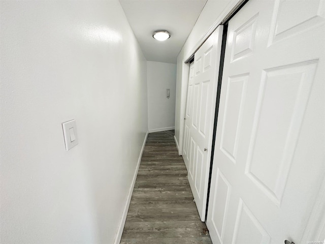 hallway with dark hardwood / wood-style floors