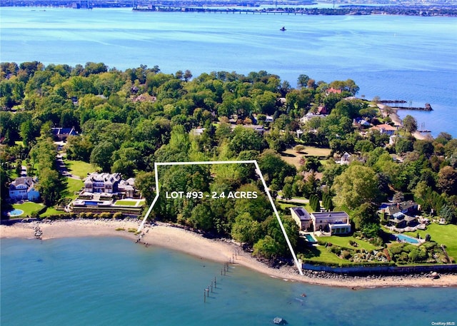 bird's eye view featuring a view of the beach and a water view