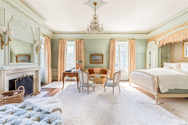 bedroom with ornamental molding and a notable chandelier