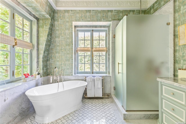 bathroom with tile patterned flooring, radiator heating unit, vanity, and independent shower and bath