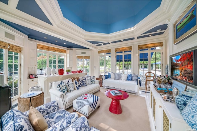 sunroom / solarium featuring a raised ceiling and french doors