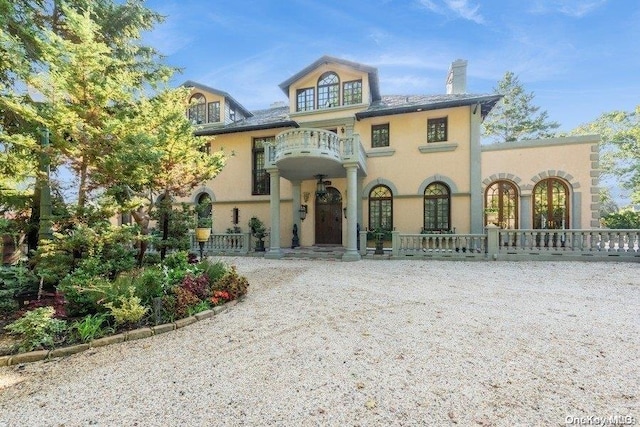 view of front of property with a porch and a balcony