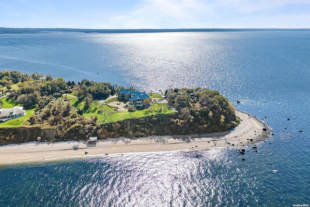 drone / aerial view featuring a water view and a beach view