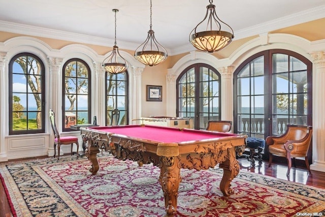 game room with plenty of natural light, wood-type flooring, crown molding, and french doors