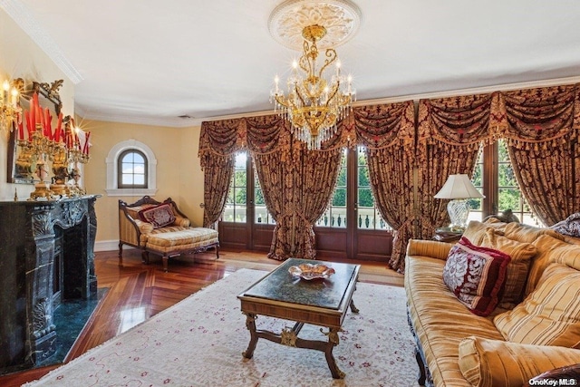 living room with french doors, an inviting chandelier, parquet flooring, crown molding, and a fireplace