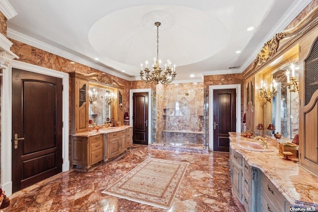 bathroom featuring vanity, a raised ceiling, ornamental molding, and a chandelier