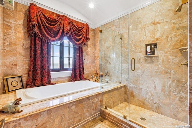 bathroom featuring crown molding, independent shower and bath, and tile walls