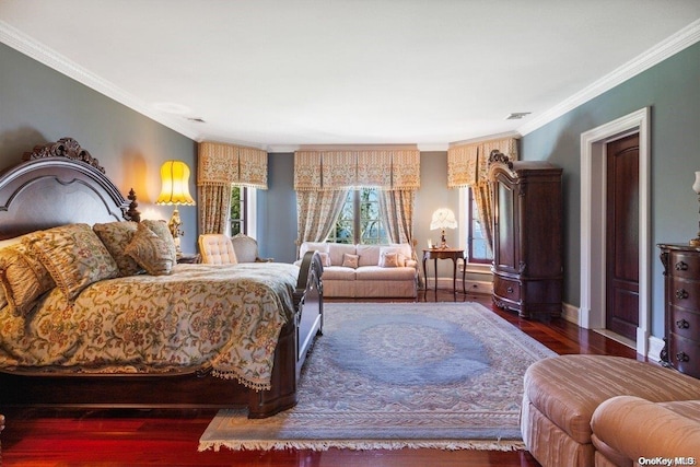 bedroom featuring dark hardwood / wood-style flooring and ornamental molding