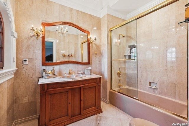 bathroom with an inviting chandelier, enclosed tub / shower combo, vanity, tile walls, and ornamental molding