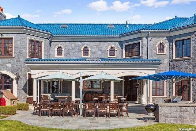 back of house featuring a patio