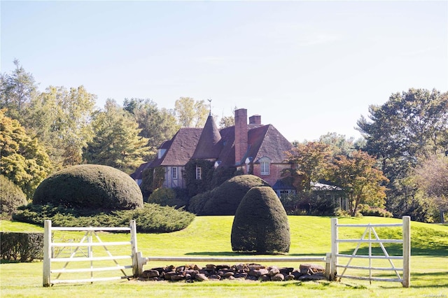 491 Muttontown Rd, Muttontown, NY 11791 - view of home's exterior with a chimney and a lawn