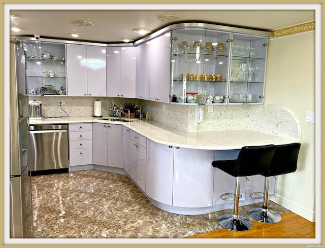 kitchen featuring decorative backsplash, appliances with stainless steel finishes, gray cabinetry, and sink