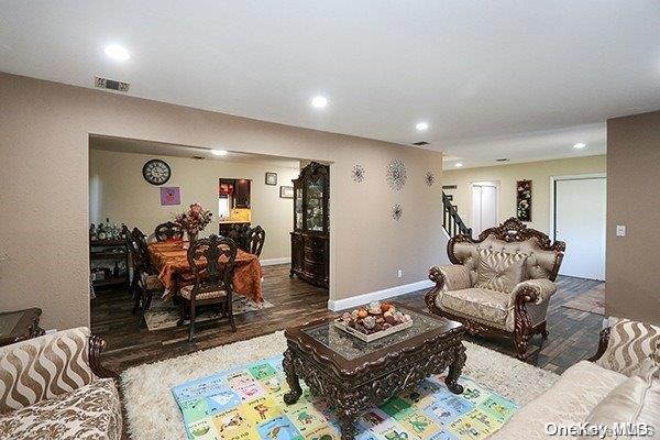 living room featuring dark hardwood / wood-style flooring