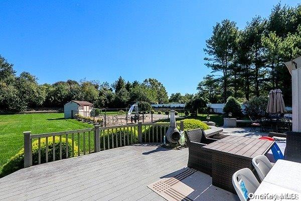 wooden deck with a yard