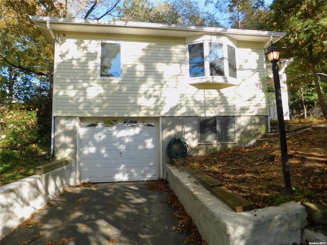 view of side of home with a garage