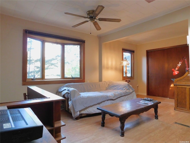 bedroom featuring ceiling fan and light hardwood / wood-style flooring