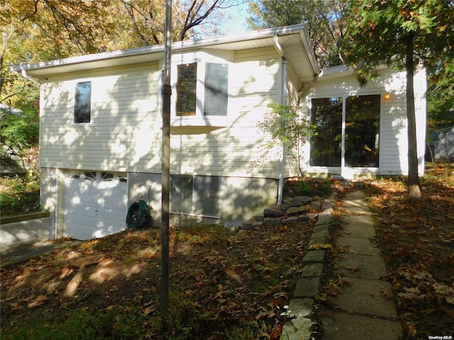 view of side of property featuring a garage