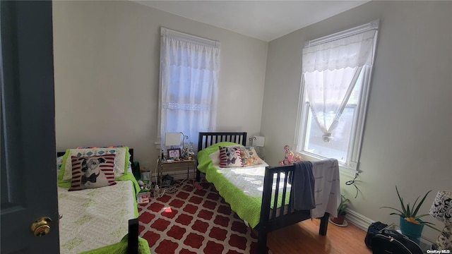 bedroom with hardwood / wood-style flooring