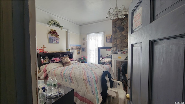 bedroom featuring crown molding and a notable chandelier