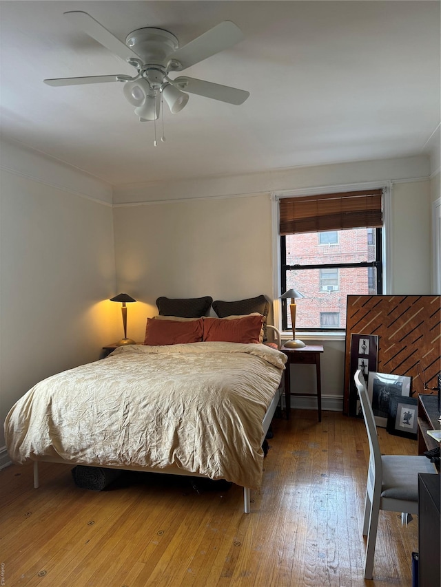 bedroom featuring ceiling fan and hardwood / wood-style floors