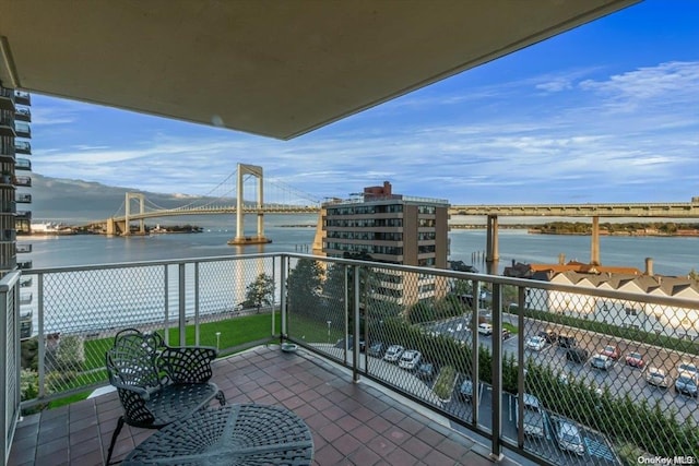 balcony featuring a water view