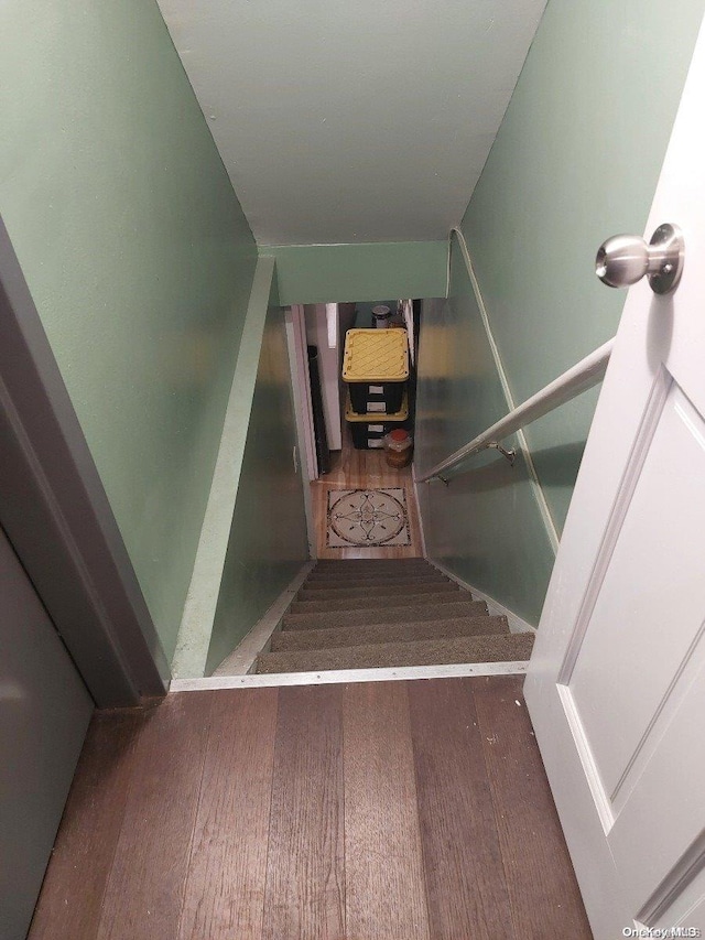 staircase featuring hardwood / wood-style flooring