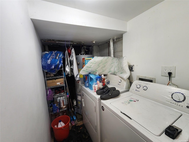 clothes washing area with washer and clothes dryer