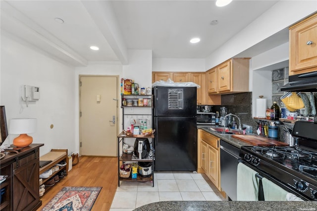 kitchen featuring black appliances, light brown cabinets, sink, and light hardwood / wood-style flooring