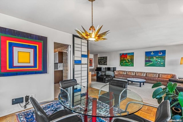 dining room featuring parquet flooring