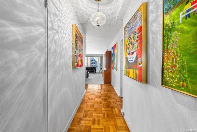 corridor featuring light parquet flooring