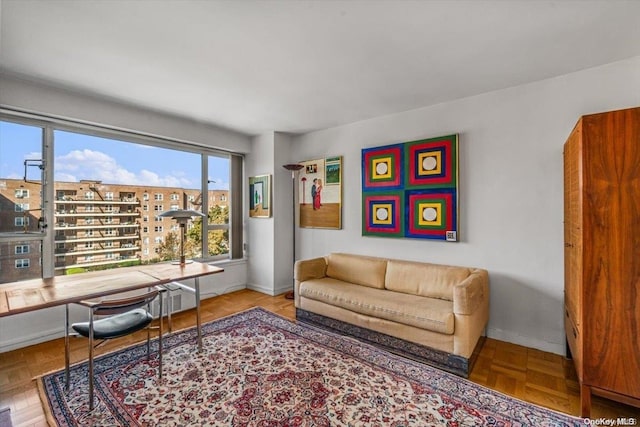 living room featuring parquet flooring