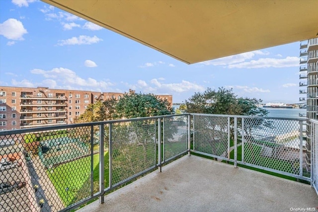 balcony featuring a water view