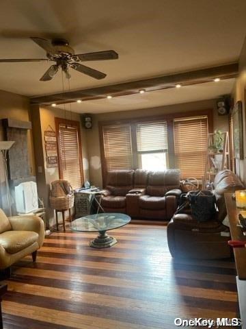 living room featuring hardwood / wood-style flooring and ceiling fan