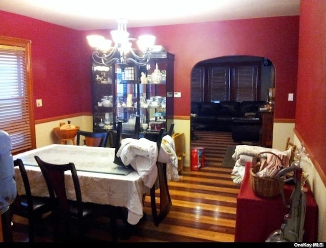 dining room with a chandelier and hardwood / wood-style floors