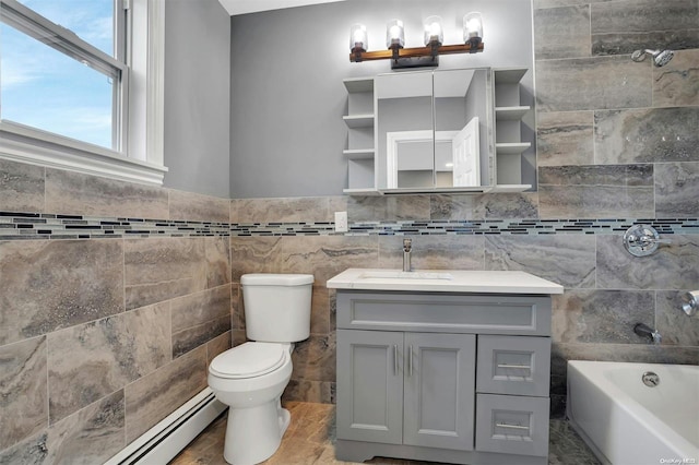 bathroom with vanity, a bathing tub, toilet, tile walls, and a baseboard radiator