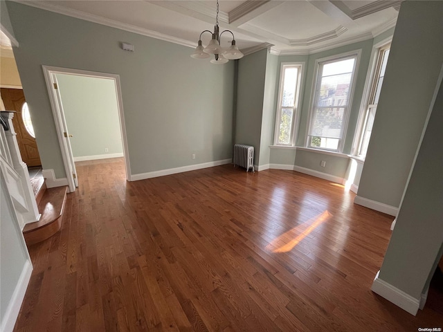 unfurnished dining area featuring an inviting chandelier, radiator heating unit, dark wood-type flooring, and ornamental molding