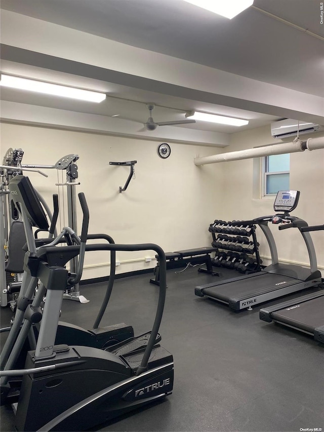 workout area featuring a wall mounted air conditioner